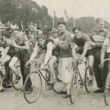 Trainers, wearing Dürkopp jerseys, with four cyclists, Golden Gate Park Polo Field, San Francisco  1939