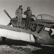 Photographer Toni Frissell with Major George S. Roberts on the wing of his North American P-51D Mustang  March 1945