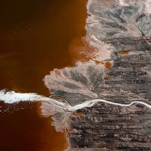 Expectoration: Plume of foam in bauxite waste, Darrow, Louisiana