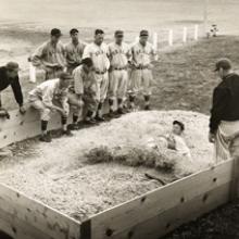 Dario Lodigiani of the Oakland Oaks sliding into third base 
