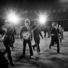 The Beatles walk across the field to the stage at Candlestick Park  August 29, 1966