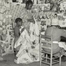 Jennie Pettway and another girl help the quilter Jorena Pettway construct a quilt Gees Bend, Alabama 1937