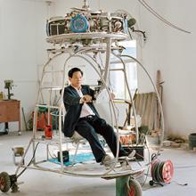 Zhang Dousan works in construction and works on Dousan No. 5 in his spare time—he has spent three years and more than $70,000 working on this coaxial-type helicopter  2015   