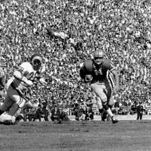 Quarterback Bobby Waters rushes from the shotgun formation for eleven yards during a 35-0 victory over the Los Angeles Rams at Kezar Stadium    October 8, 1961