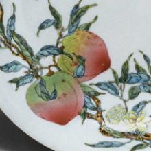 Plate with eight peaches and five bats