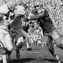 Linebacker Dave Wilcox prepares to tackle running back Leroy Kelly during the third quarter of a 34-31 victory over the Cleveland Browns at Kezar Stadium