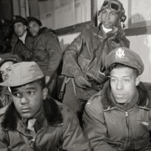 332nd Fighter Group pilots attending a briefing: (L-R front) Joseph L. Chineworth, Emile G. Clifton, Richard S. Harder, (L-R back) Frank N. Wright, Robert J. Murdic, Jimmie D. Wheeler  March 1945