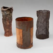 Vase (#2279)  2005 June Schwarcz (b. 1918) electroformed copper mesh, black and red-brown patina L2013.2601.022  Vase (#1060)  1990 June Schwarcz (b. 1918) electroformed copper foil, dark orange and pink enamel interior, gold enamel and rusted-iron bands exterior L2013.2601.042  Vase (#2331)  2007 June Schwarcz (b. 1918) electroformed copper mesh, black patina L2013.2601.023