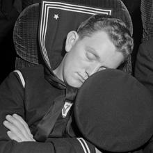 A sailor asleep on a bus enroute from Roanoke, Virginia, to Washington, D.C.  1943