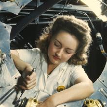 Assembling part of the engine cowling for a North American B-25 Mitchell bomber at the North American Aviation plant