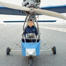Wang Qiang sits inside the Wang Qiang No.2, a fixed-wing aircraft that uses a Yamaha engine from a boat. He spent approximately four months and $5,000 to construct the aircraft, which can reach an altitude of nearly 5,000 feet  2015