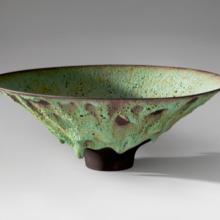 Bowl  2002 James Lovera (b. 1920) porcelain, pale green lava flow glaze over black slip L2013.2601.001
