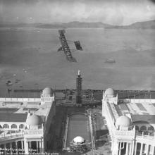 Lincoln Beachey performing in his biplane over the Panama-Pacific International Exposition grounds, San Francisco  December 25, 1913