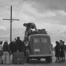 Loading bus, leaving Manzanar for relocation  1943