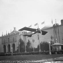 Lincoln Beachey waving to the crowd from his monoplane at the Panama-Pacific International Exposition, San Francisco  March 14, 1915