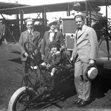 Art Smith (at left) with his biplane and fairgoers at the Panama-Pacific International Exposition, San Francisco  1915