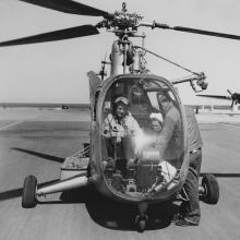 Sikorsky R-6A Hoverfly helicopter is readied for flight with Boeing PB-1G in background at Coast Guard Air Station San Francisco