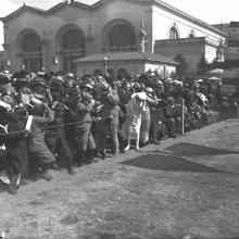 Spectators in the prop wash as Art Smith revs his engine for takeoff at the Panama-Pacific International Exposition, San Francisco  1915