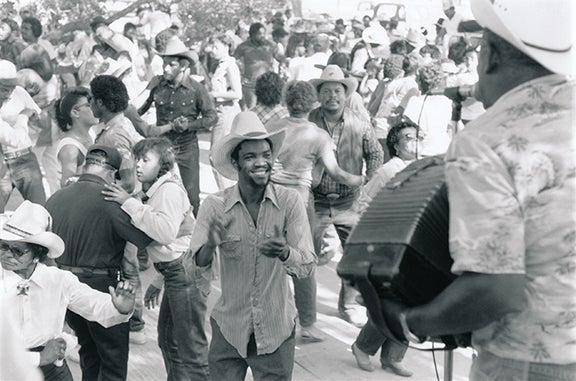 “Boozoo” Chavis playing an outdoor dance after a Creole “trail ride”  1987 near Lake Charles, Louisiana Photograph: Chris Strachwitz Courtesy of Chris Strachwitz and/or the Arhoolie Foundation R2018.1101.252